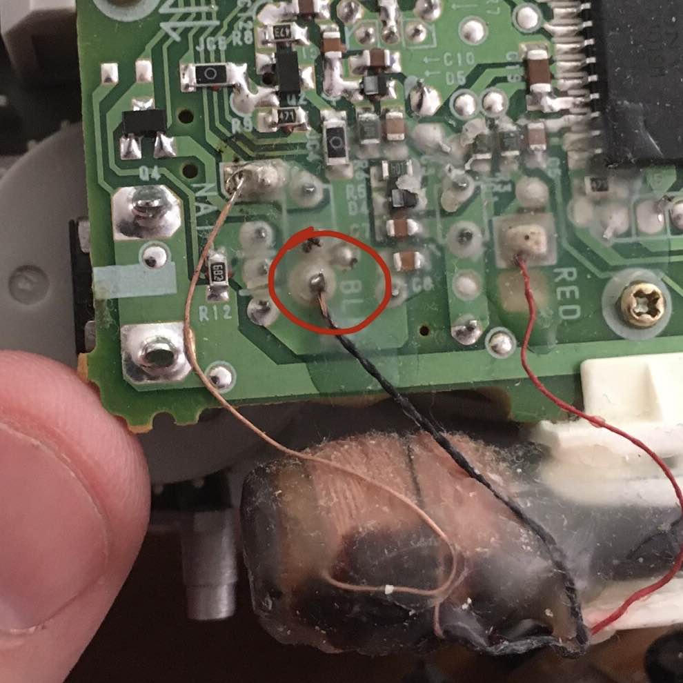 close-up of the board showing a wire
from the tuning coil reattached to the board