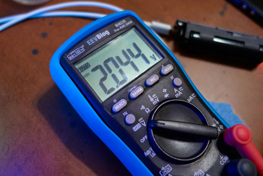 multimeter measuring 2.044 volts